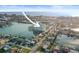 Aerial view of a waterfront condo building on a peninsula with boat docks and beautiful water views at 420 64Th Ave # 1005, St Pete Beach, FL 33706