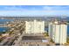Elevated view of a condo complex with expansive parking and water views at 420 64Th Ave # 1005, St Pete Beach, FL 33706