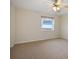 Bedroom features carpeting, a ceiling fan, and a window at 420 64Th Ave # 1005, St Pete Beach, FL 33706
