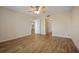 Bedroom showing the hardwood floors and a view into other rooms at 420 64Th Ave # 1005, St Pete Beach, FL 33706