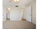 Bright bedroom with a ceiling fan, large closet, and carpet floors at 420 64Th Ave # 1005, St Pete Beach, FL 33706