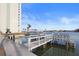 Community boat dock with multiple boat slips and well maintained landscaping at 420 64Th Ave # 1005, St Pete Beach, FL 33706