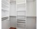 Walk-in closet with built-in shelving for optimal storage at 420 64Th Ave # 1005, St Pete Beach, FL 33706