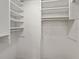 Walk-in closet with built-in shelving for optimal storage at 420 64Th Ave # 1005, St Pete Beach, FL 33706