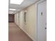 Hallway view features neutral paint and carpet in a building offering waterfront living at 420 64Th Ave # 1005, St Pete Beach, FL 33706