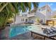 Relaxing backyard pool with tropical landscaping and wooden deck offers a perfect outdoor retreat at 425 20Th Ne Ave, St Petersburg, FL 33704