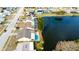 Aerial view of houses with pools along a waterfront at 4728 Swallowtail Dr, New Port Richey, FL 34653