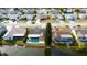 Aerial view of waterfront home with backyard pool surrounded by a quiet residential neighborhood at 4728 Swallowtail Dr, New Port Richey, FL 34653