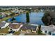 Lakefront homes featuring mature landscaping and beautiful lake views in a desirable neighborhood setting at 4728 Swallowtail Dr, New Port Richey, FL 34653