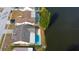 Aerial shot of houses with pools along waterfronts at 4728 Swallowtail Dr, New Port Richey, FL 34653