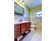 Bathroom with a single vanity, a quartz countertop, framed mirror and a decorative tile backsplash at 4728 Swallowtail Dr, New Port Richey, FL 34653