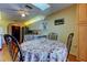 Cozy dining area features natural lighting, seating for four, and a charming floral tablecloth at 4728 Swallowtail Dr, New Port Richey, FL 34653