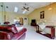 Bright living area with tile floors, vaulted ceilings, and a view of the dining room at 4728 Swallowtail Dr, New Port Richey, FL 34653