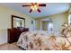 Cozy main bedroom with an ensuite, dresser, and easy access to an outdoor seating area at 4728 Swallowtail Dr, New Port Richey, FL 34653