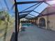 Screened-in pool with lounge chairs; perfect for relaxing by the pool at 4728 Swallowtail Dr, New Port Richey, FL 34653