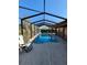 Sparkling in-ground pool offers a refreshing escape in this screened enclosure at 4728 Swallowtail Dr, New Port Richey, FL 34653