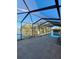 Screened-in pool with waterfront view, creating a private outdoor oasis at 4728 Swallowtail Dr, New Port Richey, FL 34653