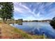 Peaceful waterfront view with sky reflecting off of the calm water at 4728 Swallowtail Dr, New Port Richey, FL 34653