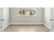 Bright bedroom showcasing neutral paint, white trim and vinyl flooring at 11683 Rose Gold Ct, Venice, FL 34293