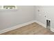 Laundry room with wood-style flooring and new washer/dryer hookups at 11683 Rose Gold Ct, Venice, FL 34293