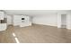 Open-concept living space featuring hardwood floors, recessed lighting, and a modern kitchen at 11683 Rose Gold Ct, Venice, FL 34293