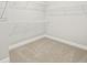 Walk-in closet featuring wire shelving and neutral carpeting at 11683 Rose Gold Ct, Venice, FL 34293