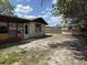 Spacious backyard view with a small storage shed and ample space for landscaping and outdoor activities at 12812 1St Isle, Hudson, FL 34667