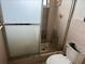 Bathroom toilet and shower with grime at 12812 1St Isle, Hudson, FL 34667