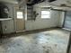 Interior view of garage featuring door, walls, and lighting at 12812 1St Isle, Hudson, FL 34667
