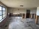 Empty Living room with exposed stud walls and large window for natural light at 12812 1St Isle, Hudson, FL 34667