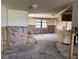 Bright living space needing repair with natural light and an open layout that enhances the home's potential at 12812 1St Isle, Hudson, FL 34667