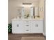 Bright bathroom with double vanity, modern fixtures, and stylish mirrors at 12918 Cambridge Ave, Tampa, FL 33624
