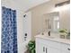 Bright bathroom with a shower-tub combo featuring white subway tile and a modern vanity with marble countertop at 12918 Cambridge Ave, Tampa, FL 33624