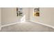 Bright bedroom with two windows offering natural light and views of the outdoors at 12918 Cambridge Ave, Tampa, FL 33624