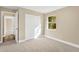 Inviting bedroom featuring a closet, neutral walls, and carpet flooring for a cozy feel at 12918 Cambridge Ave, Tampa, FL 33624