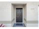 Stylish black front door with modern hardware and clear address numbers at 12918 Cambridge Ave, Tampa, FL 33624
