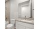 This bathroom features a modern vanity, neutral tile, and a shower with white fixtures at 18491 Green Garden Ct, Venice, FL 34293