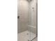 Beautiful walk-in shower with glass enclosure and tile surround at 18491 Green Garden Ct, Venice, FL 34293
