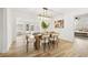 Chic dining room featuring modern light fixture, stylish decor, and wood flooring at 2181 Wateroak N Dr, Clearwater, FL 33764