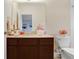 Well-lit bathroom with a vanity, plush towels, and ample storage for personal care at 310 Summer Clouds Pl, Brandon, FL 33511