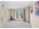 Serene bedroom with neutral tones, large windows and comfortable carpeting for relaxation at 310 Summer Clouds Pl, Brandon, FL 33511