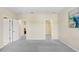 Bright bedroom featuring neutral carpeting, an ensuite bath, and a walk in closet at 310 Summer Clouds Pl, Brandon, FL 33511