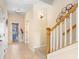Bright foyer boasts tile flooring, modern decor, and staircase at 310 Summer Clouds Pl, Brandon, FL 33511