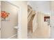 Inviting entryway features tile flooring, staircase, half bath, and neutral color scheme at 310 Summer Clouds Pl, Brandon, FL 33511
