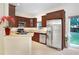 Charming kitchen featuring stainless steel appliances, sleek countertops and an open layout at 310 Summer Clouds Pl, Brandon, FL 33511