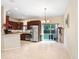 Open-concept kitchen with stainless steel appliances, wood cabinetry, and tile floors at 310 Summer Clouds Pl, Brandon, FL 33511