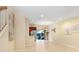 Open concept living space with tile floors, neutral paint, and sliding glass doors to backyard at 310 Summer Clouds Pl, Brandon, FL 33511