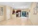 Bright open-concept living area features tile flooring and access to a patio through sliding glass doors at 310 Summer Clouds Pl, Brandon, FL 33511