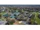 Aerial view of community pool, tennis courts, playground, and golf course at 3110 Bent Creek Dr, Valrico, FL 33596