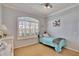 Inviting bedroom with light walls, large window with plantation shutters, and comfortable bed at 3110 Bent Creek Dr, Valrico, FL 33596